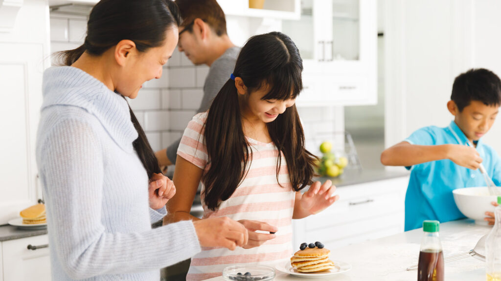 Carolina family cooking with refaced kitchen cabinets by kitchen cabinet pros